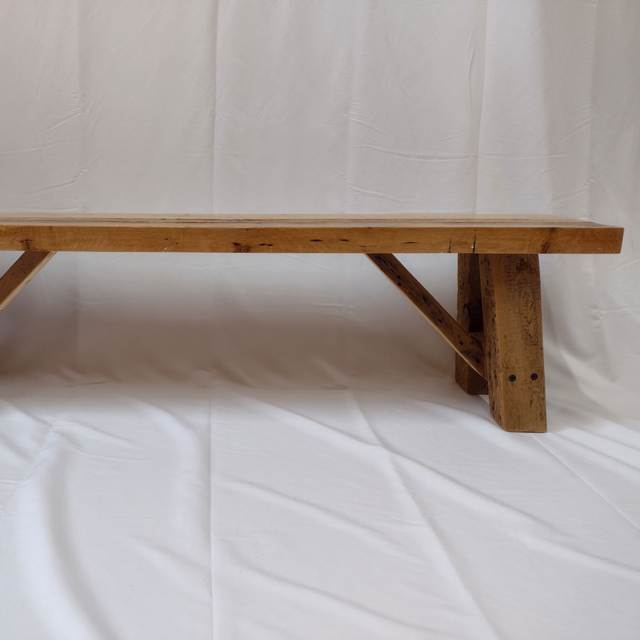 The reclaimed oak bench is hand-crafted from salvaged lumber. This reclaimed bench is sure to enhance the beauty of any kitchen or dining room while allowing room for the whole party.<br /><br />The bench seat is a reclaimed oak top with a butcher block build. This showcases quality, durability, and strength along with the A-frame and braces in the leg base.