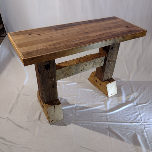 This one-of-a-kind table is sure to enhance the beauty of any hallway space, whether at home or in business. This table is built from small, reclaimed timbers, along with its unique mortise and tenon joinery. This table possesses not only durability and strength, but also authentic-rustic beauty that is sure to enhance any home business space.